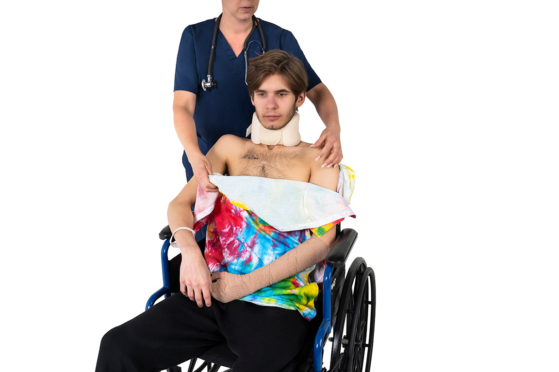 Nurse Unsnapping Adaptive T-Shirt to Dress Male Patient in Wheelchair